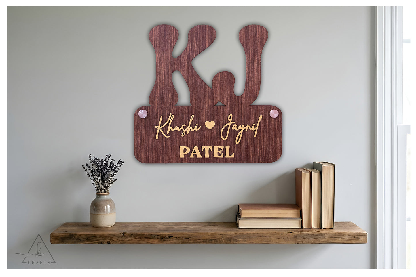 Brightly lit custom 3D wooden monogram couple last name sign featuring raised laser-cut lettering.
