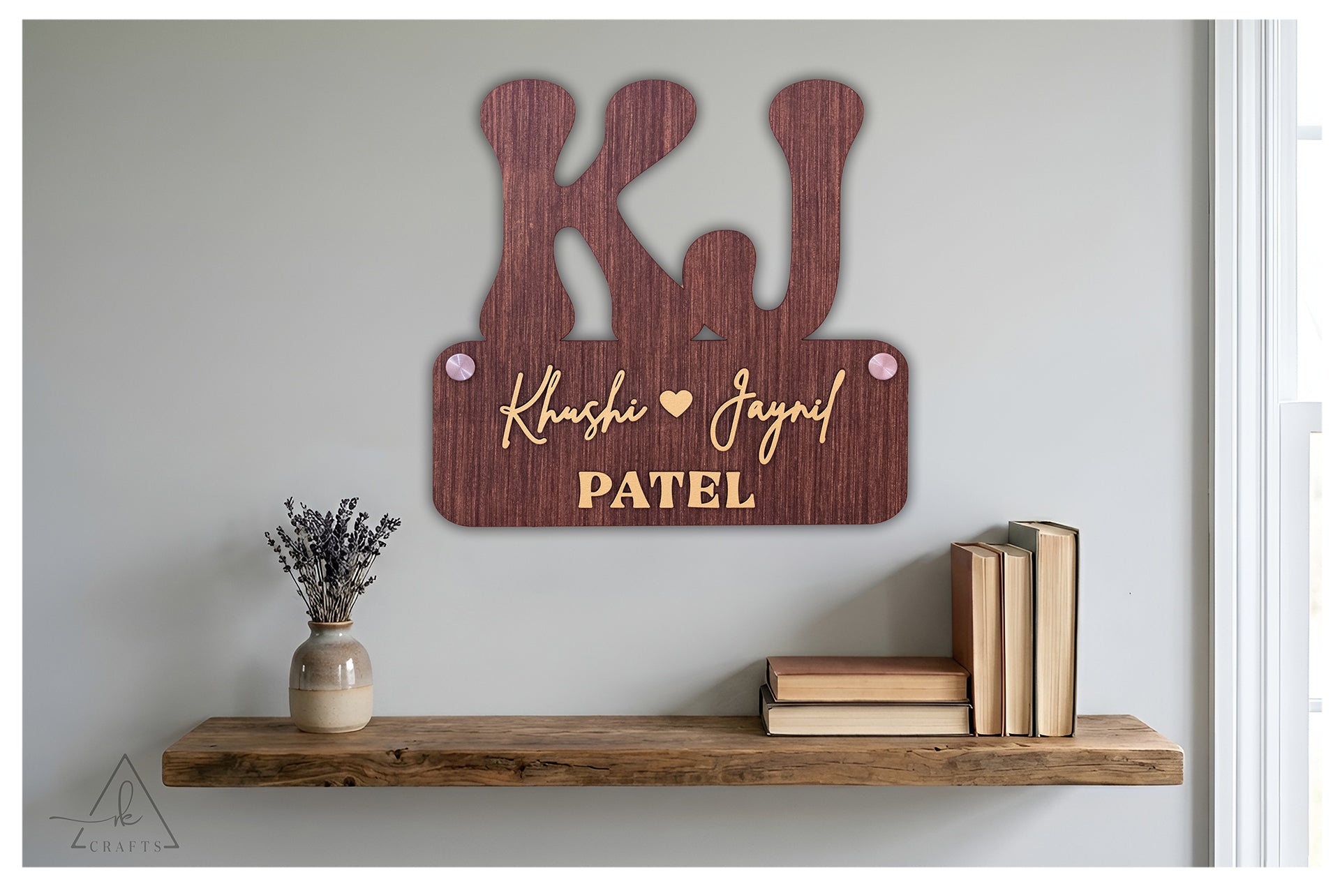 Brightly lit custom 3D wooden monogram couple last name sign featuring raised laser-cut lettering.