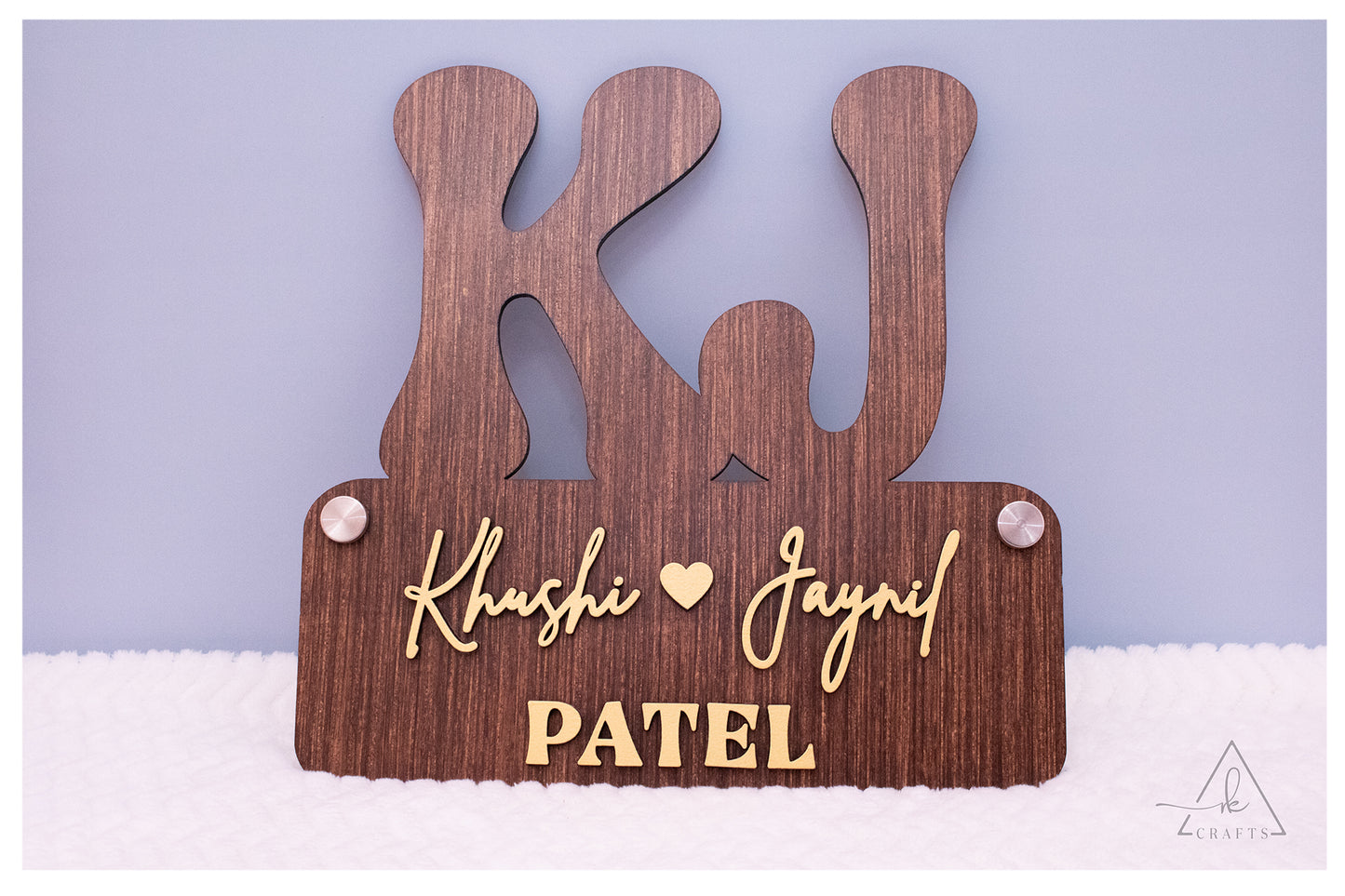 Close-up of premium 3D raised family name details on a personalized wood wedding gift sign.