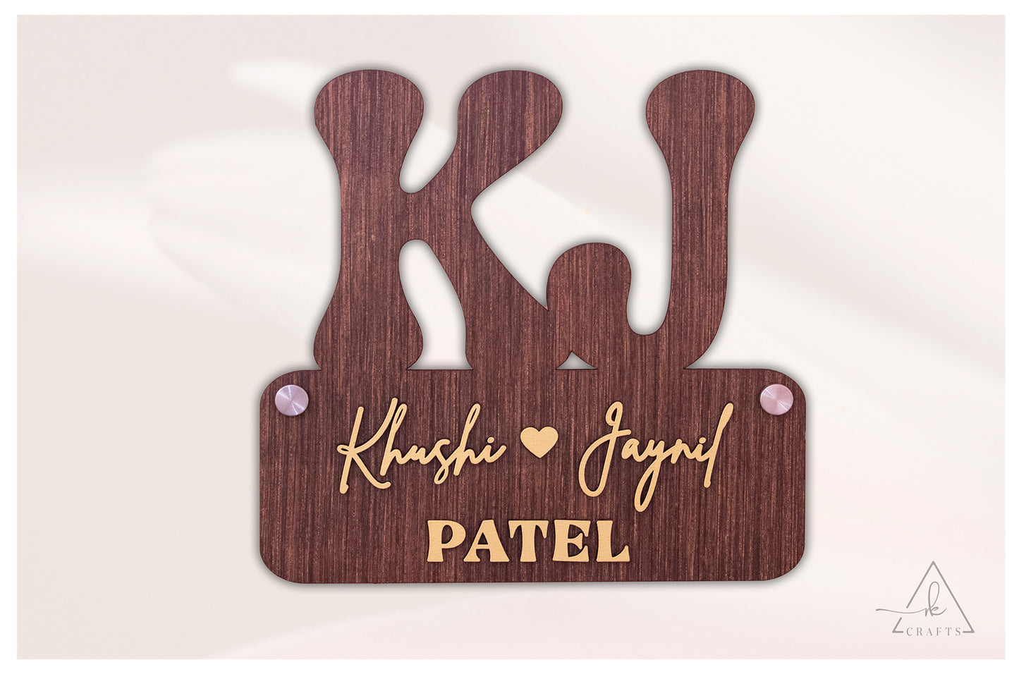Custom wooden couple last name sign showcasing distinct 3D laser-cut words against a solid wood backer.