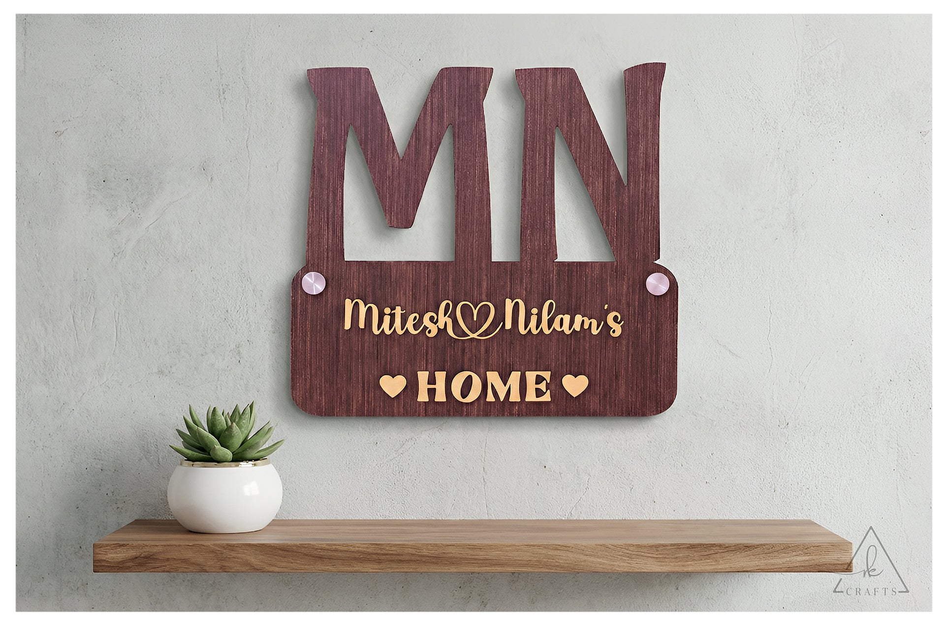 Close-up showing the clear, 3D raised wooden letters, not engraved, on a personalized couple's monogram sign.